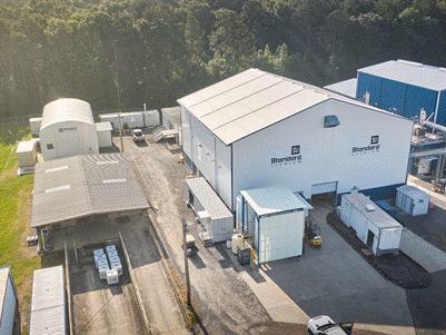 A large warehouse with many white buildings

AI-generated content may be incorrect.