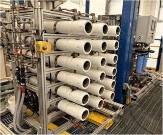 A group of white pipes on a rack

AI-generated content may be incorrect.