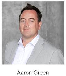 A person in a suit

Description automatically generated